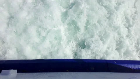 Top down view waves after a steamship with seagulls flying behind it against a Stock Footage 280871622