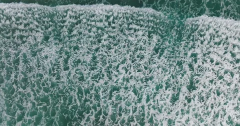 Top down view of waves breaking at shore. Aerial of seascape. Stock Footage 191726277