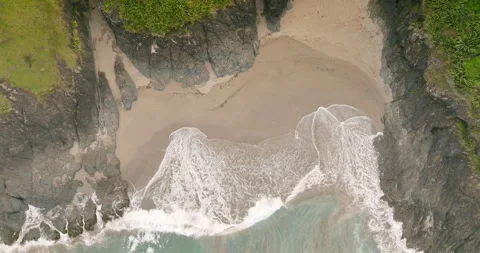 Top down view of waves breaking on a beach Stock-Footage 264466212