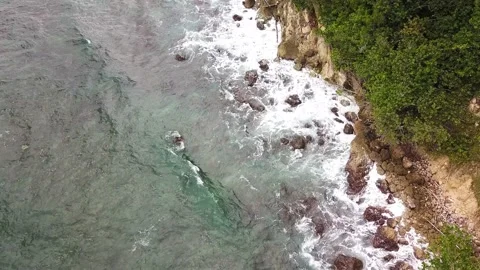 Top Down View of Waves Crashing into Rocks in Caribbean Stock-Footage 231253714
