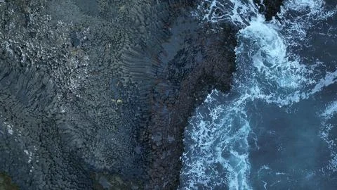 Top down view of waves crashing on basalt rock in Iceland Stock Photos