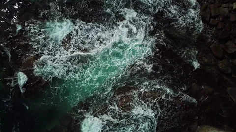 Top Down view of the Waves, Foaming and Splashing. Flight over the Pacific coast Stock Footage 105373737