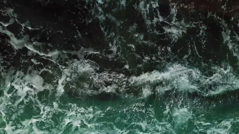 Top Down view of the Waves, Foaming and Splashing in the Ocean, waves and rocky Stock Footage 105378350