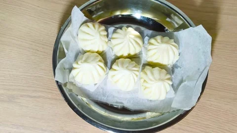 Top-down view of white Chinese steamed pork dim sum bao dumpling served on .. Stock Footage 318245958