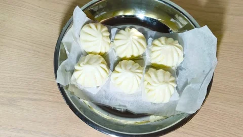 Top-down view of white Chinese steamed pork dim sum bao dumpling served on .. Stock Footage 318246231