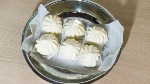Top-down view of white Chinese steamed pork dim sum bao dumpling served on .. Stock Footage 318246549