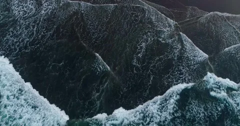 Top Down View of White Foam Waves on Sandy Beach Stock Footage 332145777