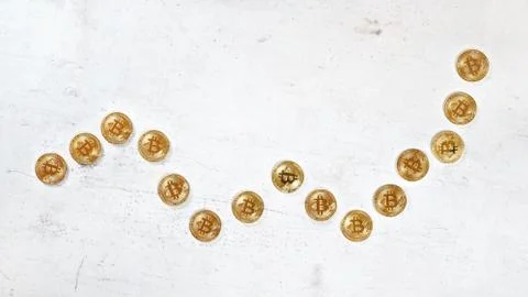 Top down view, white stone board desk with golden bitcoin coins in shape of Stock Photos