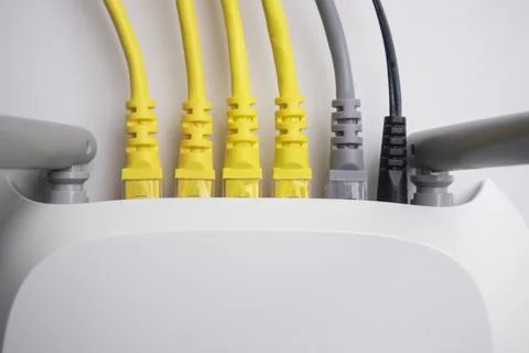 Top-down view of white wireless router back panel with four yellow, one gre.. Stock Photos