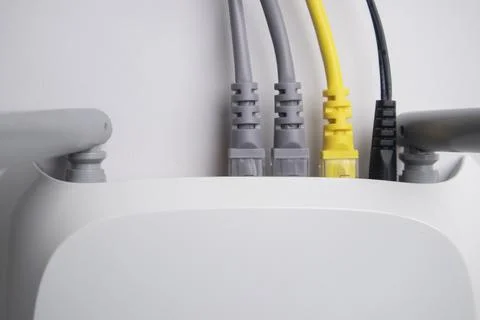 Top-down view of a white wireless router back panel with two grey Ethernet .. Stock Photos