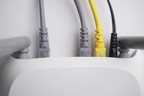 Top-down view of a white wireless router back panel with two grey Ethernet .. Stock Photos