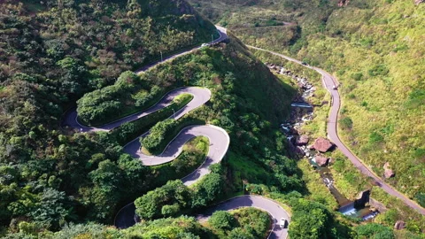 Top down view of winding road in forest Stock Footage 146629235