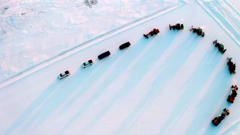 Top Down View of Winter Vehicle Convoy Curving Across Snow Stock Footage 344954161