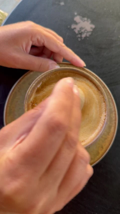 Top Down View Of Woman Hands Stirring Cappuccino At Outdoor Cafe Vídeos de archivo 335906014