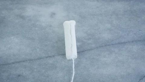 Top Down View of a Woman Replacing a Tampon with a Silicone Cup Stock Footage 102871646