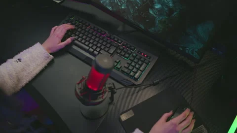 Top down view woman using keyboard and mouse for gaming at computer desk Stock Footage 307459193