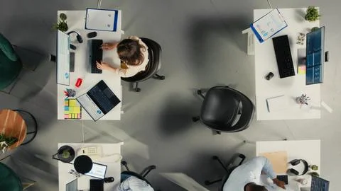 Top down view of work team engaged in negotiation consulting Stock Photos