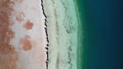 Top down view of Yamdrok Lake shoreline color bands Stock Footage 345885968