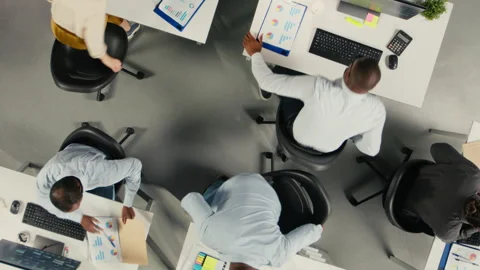 Top down view zoom out of employees review data visualization to meet objectives Stock Footage 320031763