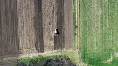 Top down view.Tractor preparing the land for sowing Видео 127181616