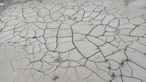 Top Down Wide Angle View of Dry Cracked Clay Mud and Drought Soil Pattern Stock Photos