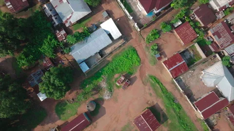 Top-down wide drone view of building in Ouesso, Congo Stock Footage 331999784
