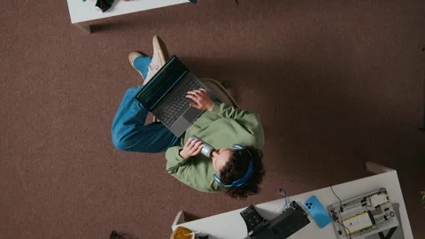 Top Down of Young Female Web Developer Coding on Laptop and Having Soft Drink Stock Footage 312448664