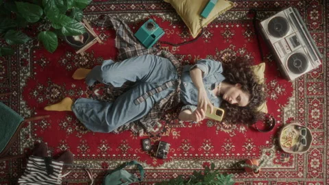 Top Down of Young Woman Taking Selfie with Phone on Vintage Carpet Stock Footage 339846665