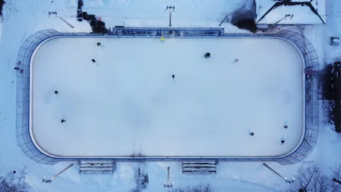 A top down zoom out view of an outdoor ice rink Stock Footage 179305775