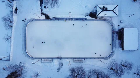 A top down zoom in view of an outdoor ice rink Stock Footage 179314420