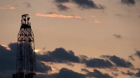 Top of the Drilling rig on the sunset clouds background. Stock Footage 259955383