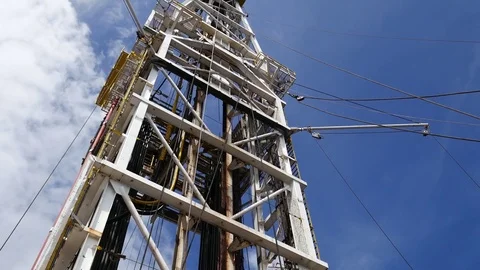 Top Drive System (TDS) moving along the dolly track of derrick Stock Footage 71097729
