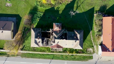 Top drone shot of  devastated castle with a collapsed roof Stock Footage 223749266