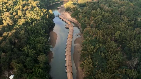 TOP DRONE SHOT OF FLOATING BUNGALOWS ON THE RIVER KWAI WITH JUNGLE 02 Stock Footage 169162980