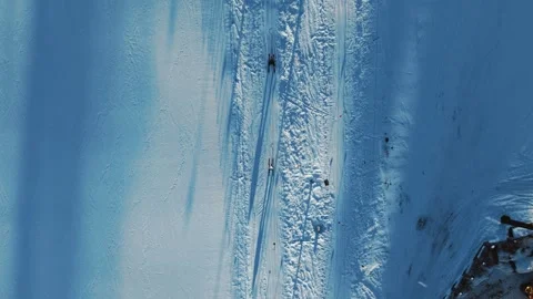 Top Drone View of Button Ski-Lift and Skiers on Sunny Winter Day Stock Footage 328846508