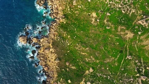 Top drone view of  coast line. Waves, sea, rocks, cliffs Stock Footage 329373023