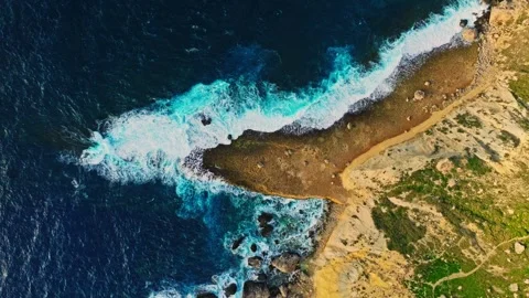 Top drone view of  coast line. Waves, sea, rocks, cliffs Stock Footage 329373342