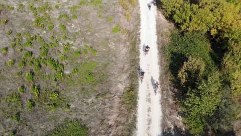 Top drone view over some bycicle riders in the countryside Stock Footage 113284556