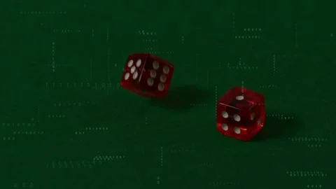 Top-edge entry launching red dice tumbling into rest on green felt, revealing Stock Footage 328685932