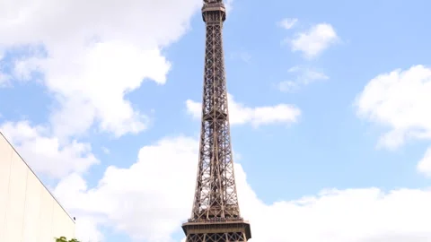 The top of the Eiffel Tower against a spring sky in Paris , France Stock Footage 260695457