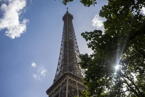 The top of the Eiffel Tower seen from the Seine River in Paris. Stock Photos