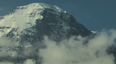 Top of Eiger North face white spider hanging glacier clouds rising Stock Footage 52219668