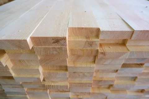 Top-end view of stack of three-layer wooden glued laminated timber beams from 스톡 사진