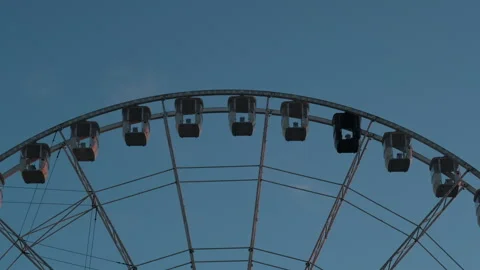 Top of Ferris Wheel Rotating at Sunset - Dark Blue Sky Stock Footage 321622786