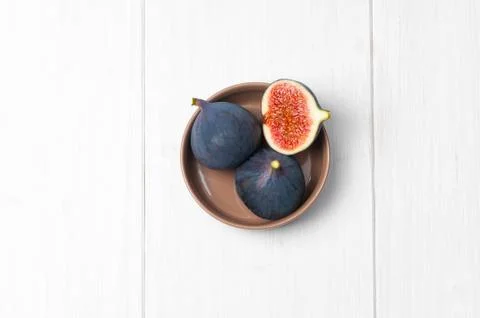 Top flat view: fresh figs on white wooden table Stock Photos