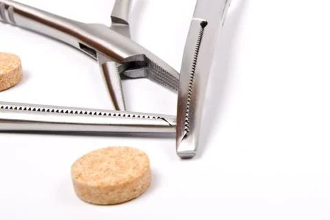 Top of forceps and tablets Stock Photos