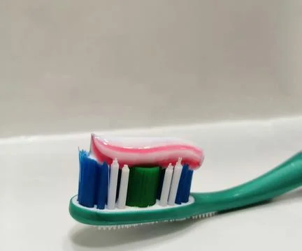 Top of a green toothbrush. Stock Photos