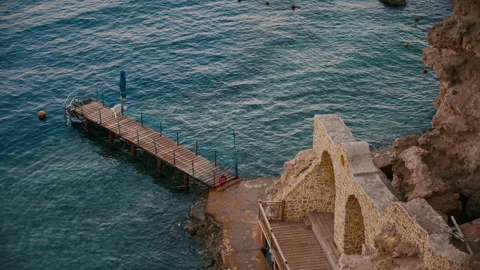 Top handheld medium shot with view on closed beach at evening time. Stock Footage 331157798