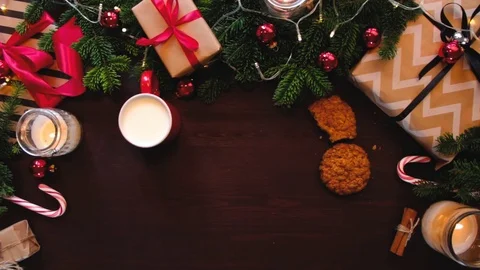 Top hands Santa Claus corrects the red ribbon on the gift Stockbeeldmateriaal 70362013