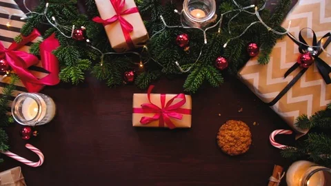 Top hands Santa Claus put a mug with milk and cookies on the table Stock Footage 70362071